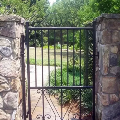 Cast-Iron-Gate-stone-walls.jpg