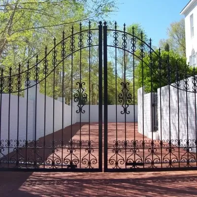 Cast-Iron-Gate-white-brick-house.jpg